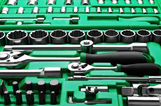 Many Tools in tool box on a white photo