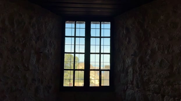 Rustic Window Frames with a Beautiful Scenic View for a Charming and Inviting Atmosphere photo