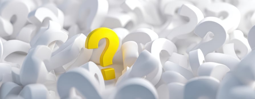 The Yellow Question Mark Amidst White Questions Representing Inquiry and Curiosity photo