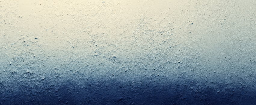 The textured gradient wall showcasing a blend of blue and cream hues. photo