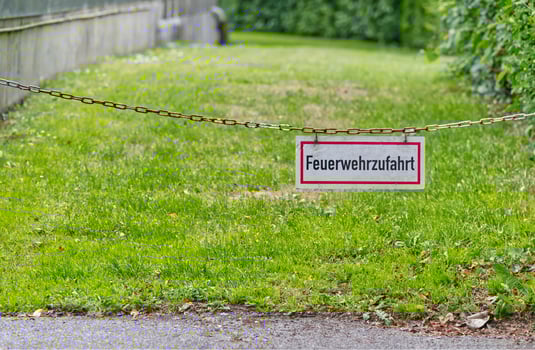 Fire Truck Access Sign with Chain on Grass photo