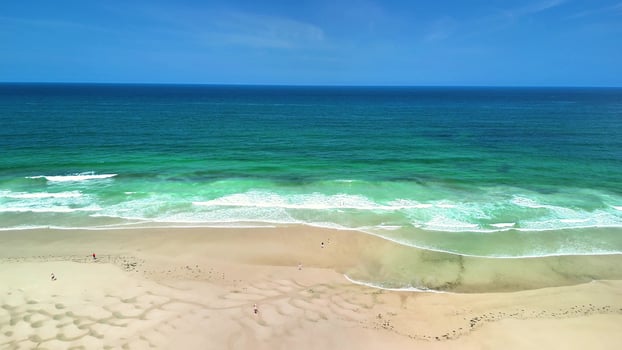 A Serene and Picturesque Coastal Beach Featuring Beautiful Turquoise Waters and Soft, Fine Sand photo