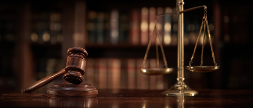 The gavel and scales present a powerful legal symbol in a courtroom setting. photo