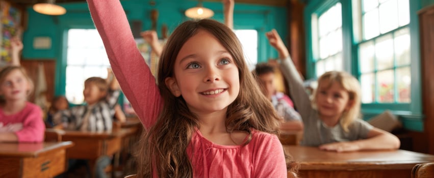The enthusiastic girl raising her hand in an inviting classroom environment. photo