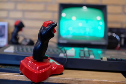 Vintage Joystick Controller in Front of Retro Monitor photo
