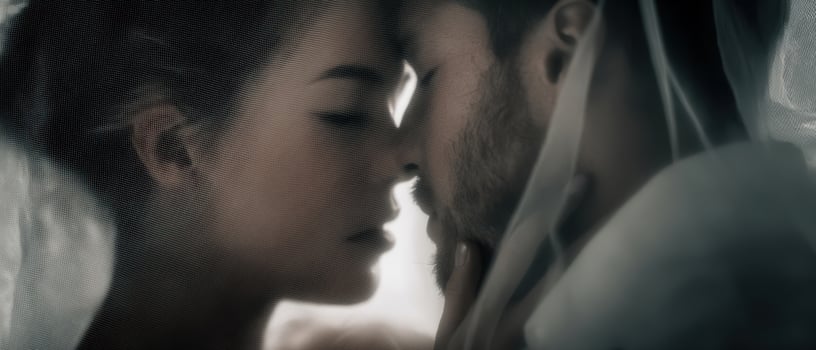 The intimate moment between a couple sharing a tender kiss. photo