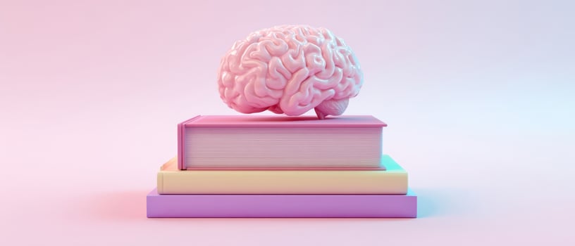 The brain resting on colorful books symbolizing knowledge and creativity. photo