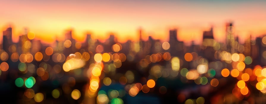 The mesmerizing bokeh lights of a city skyline at sunset. photo