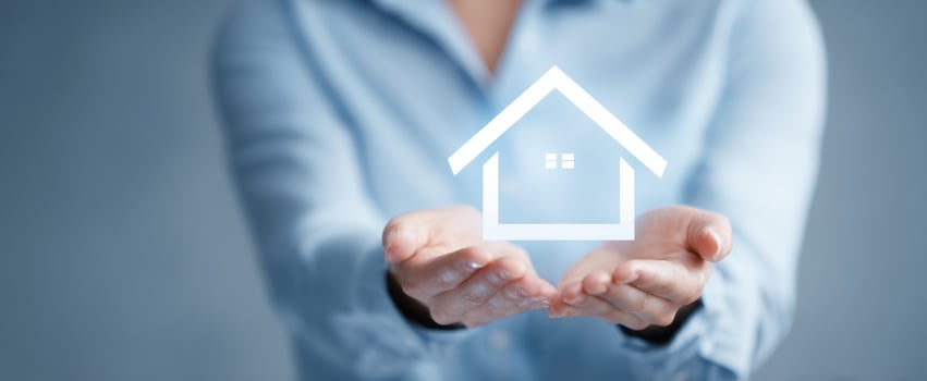 The hands holding a digital house symbolizing real estate investment and ownership. photo