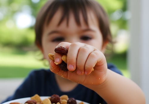Child eating snack outdoors photo