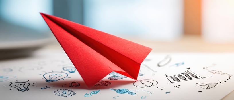 The Red Paper Airplane Representing Creativity and Innovation in Business Concepts photo