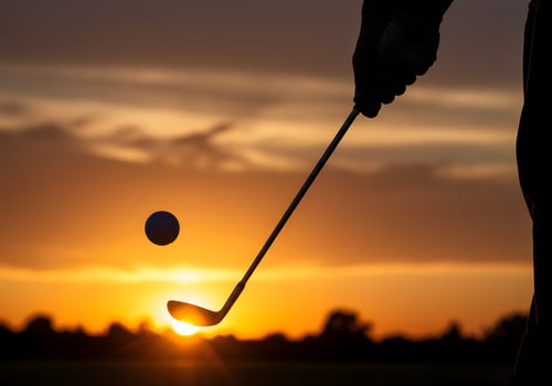Golfer silhouette sunset golf photo