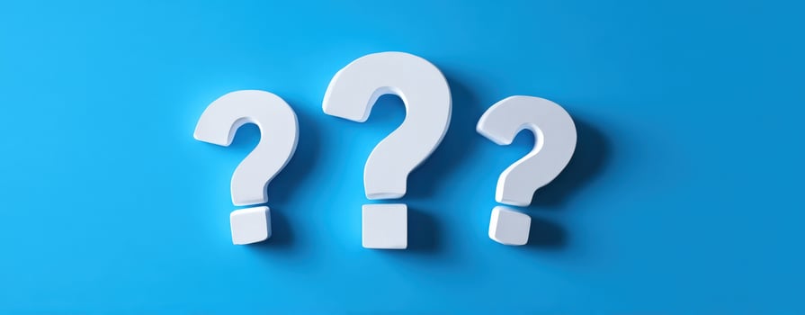 The collection of three question marks on a vibrant blue background. photo