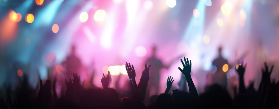 The energetic crowd at a vibrant concert under dazzling lights. photo