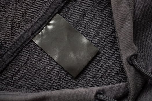 A black tag on a black jacket photo