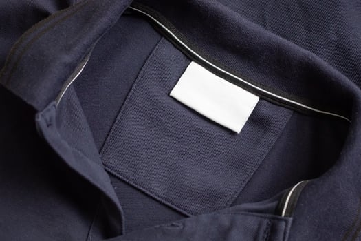 A blue shirt with a white label on it photo