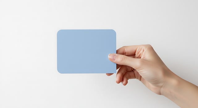 Blue Card Held by Hand photo