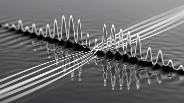 A wave of sound waves is shown on a surface photo