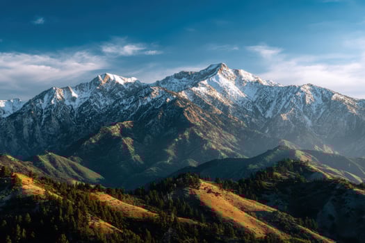 Majestic mountain range shines under golden hour light photo