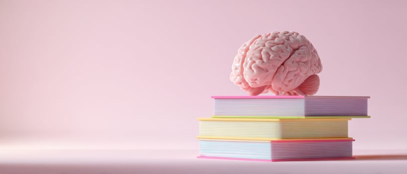 The Brain on Top of Colorful Stacked Books Representing Knowledge and Learning photo
