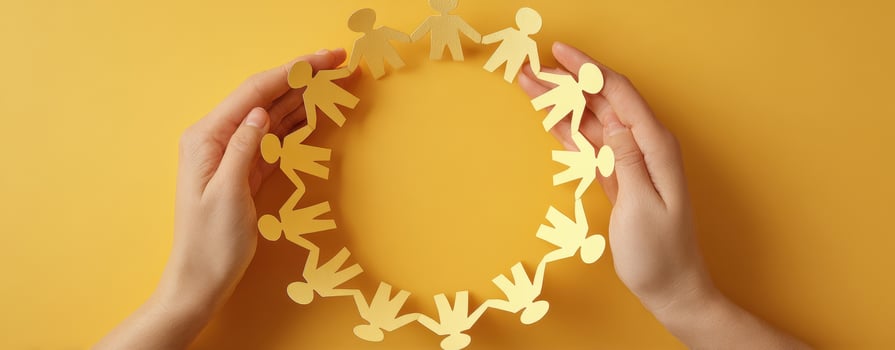 The Hands Holding a Circle of Paper People Representing Unity and Collaboration photo