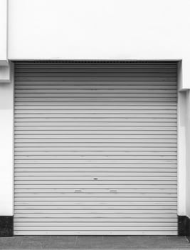 Old weathered rusty closed steel doors for steel metal store door backgroud and texture. photo