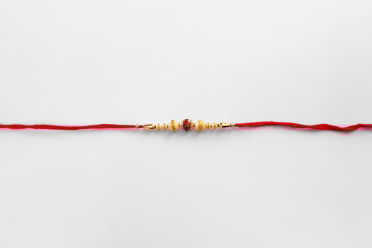 Elegant Detailed Rakhi Bracelet with Beads and Red Thread for Celebration, photo