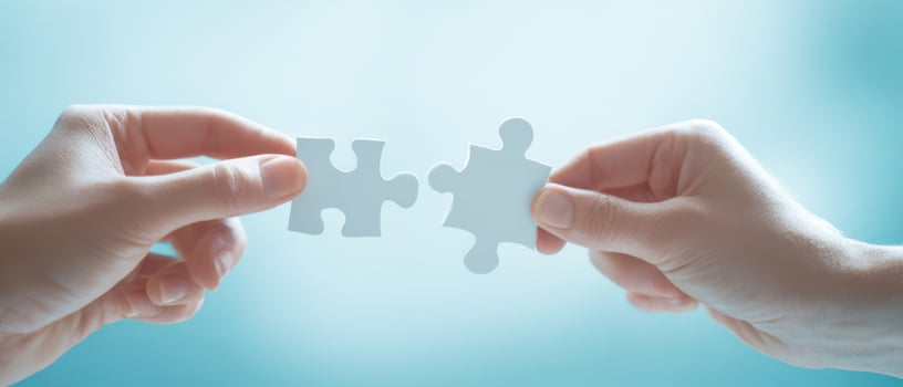 The Hands Connecting Two Puzzle Pieces Together in Unity photo
