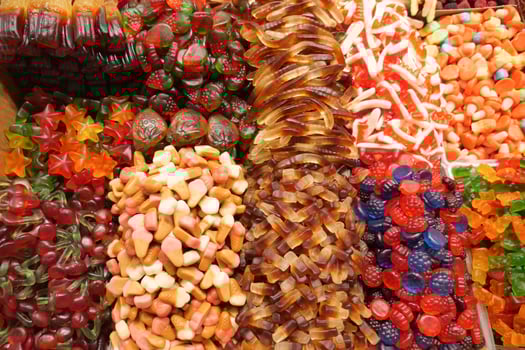 Colorful candy assortment displayed in a market stall photo