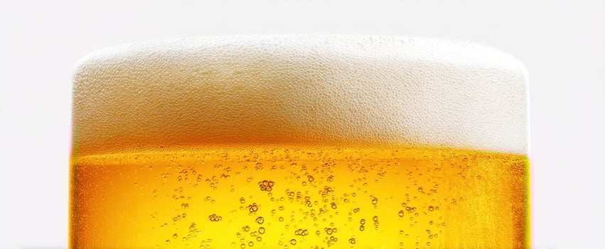 The frothy golden beer in a glass inviting refreshing enjoyment. photo