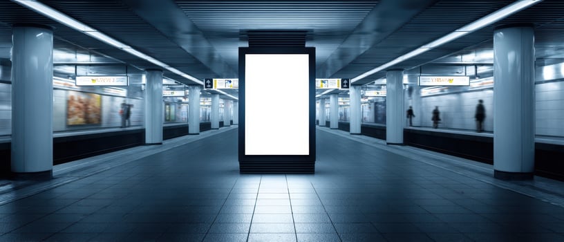 The empty subway station featuring a blank advertising space and modern architecture. photo