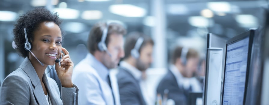 The smiling call center agent providing excellent customer service in a busy office. photo
