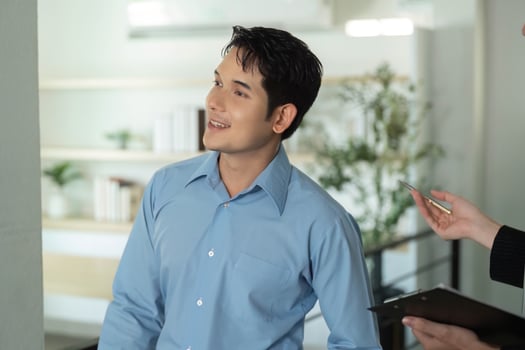 Business Meeting. Professional man discussing project details with colleague in modern office. photo