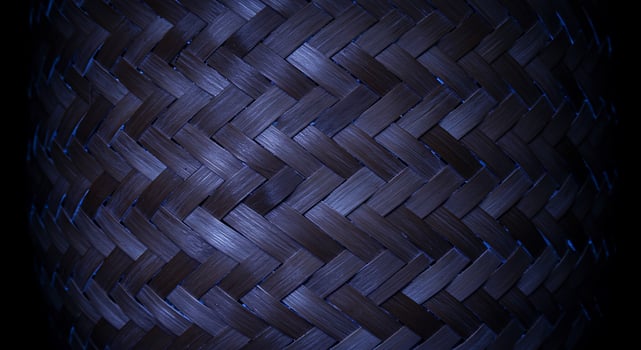Close Up of Dark Brown Woven Material with Blue Accent Lighting photo