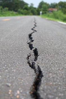 Road cracks, damage to transportation systems photo
