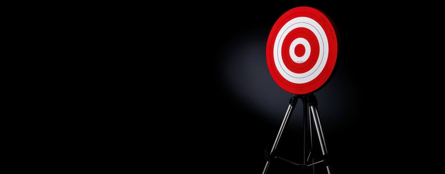 The striking red target symbolizing focus and precision against a dark backdrop. photo