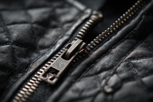 A close up of a zipper on a black jacket photo