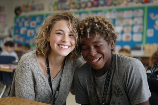 A young girl and boy smile at the camera photo