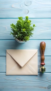 Elegant Cream Envelope with Sealing Wax and Greenery on Blue Wood flat photo