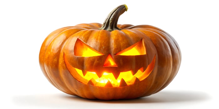 Spooky Halloween Jack o lantern with Glowing Eyes and Teeth Orange pumpkin photo