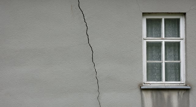 Cracked Gray Wall with White Window and Lace Curtains photo