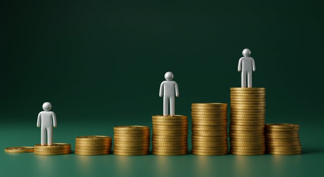 Silver Figures on Ascending Gold Coin Stacks on Green Background photo