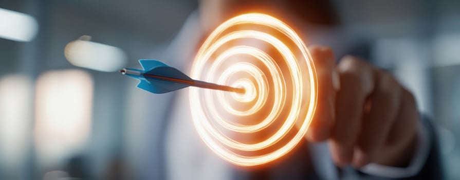 The arrow hitting the target with glowing circles representing success and achievement. photo