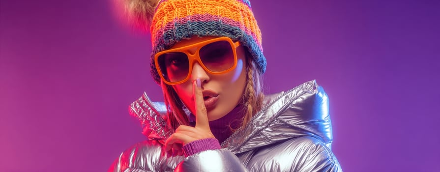 The fashion model in shiny winter attire poses with confidence and style. photo