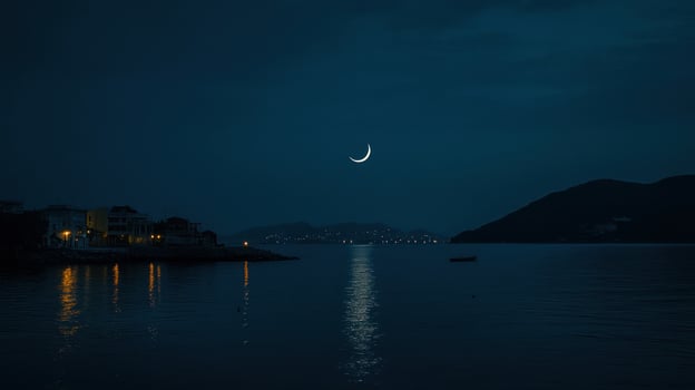 Night scene of a crescent moon over a calm sea photo