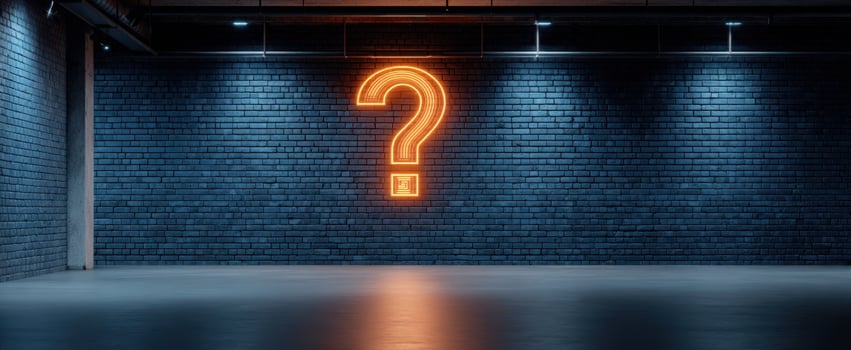 The neon question mark illuminating a modern industrial space. photo