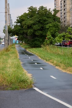 The Urban Cycling Path is Beautifully Surrounded by Lush Greenery and Scenic Views photo