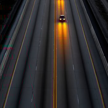 A car driving on a highway at night photo