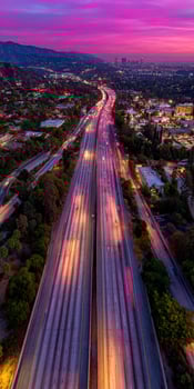An aerial view of the freeway at sunset photo