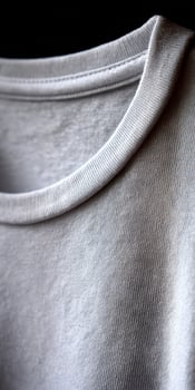 A close up of a white shirt with a black background photo